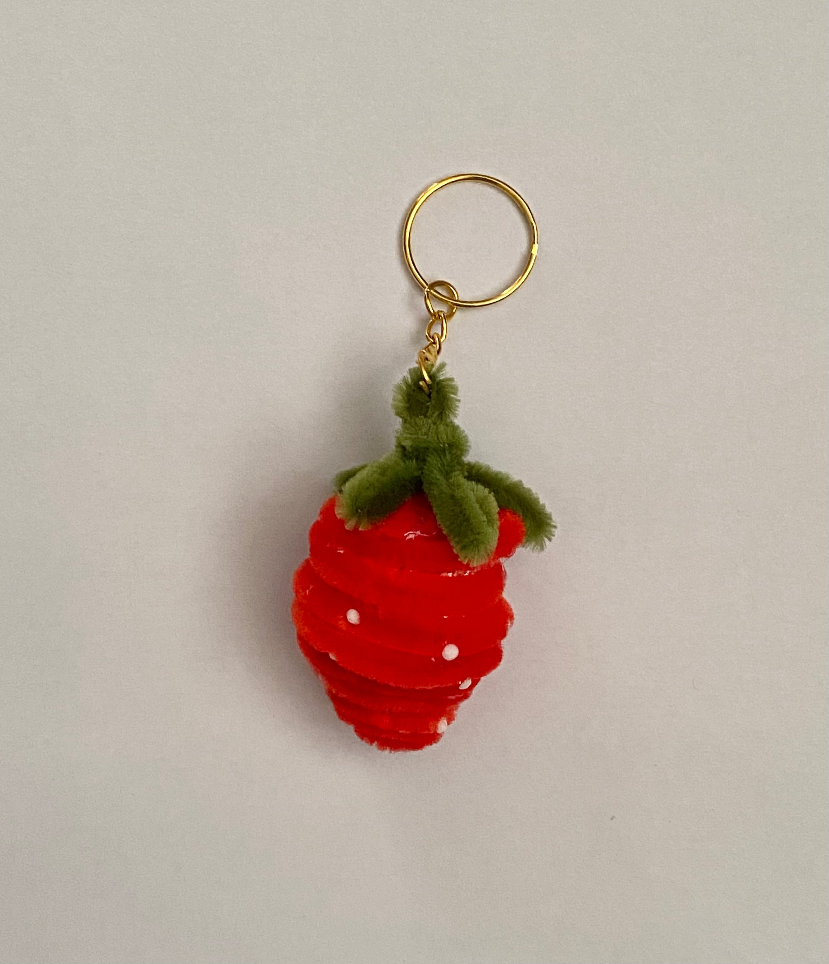 Strawberry pipe cleaner keychain.