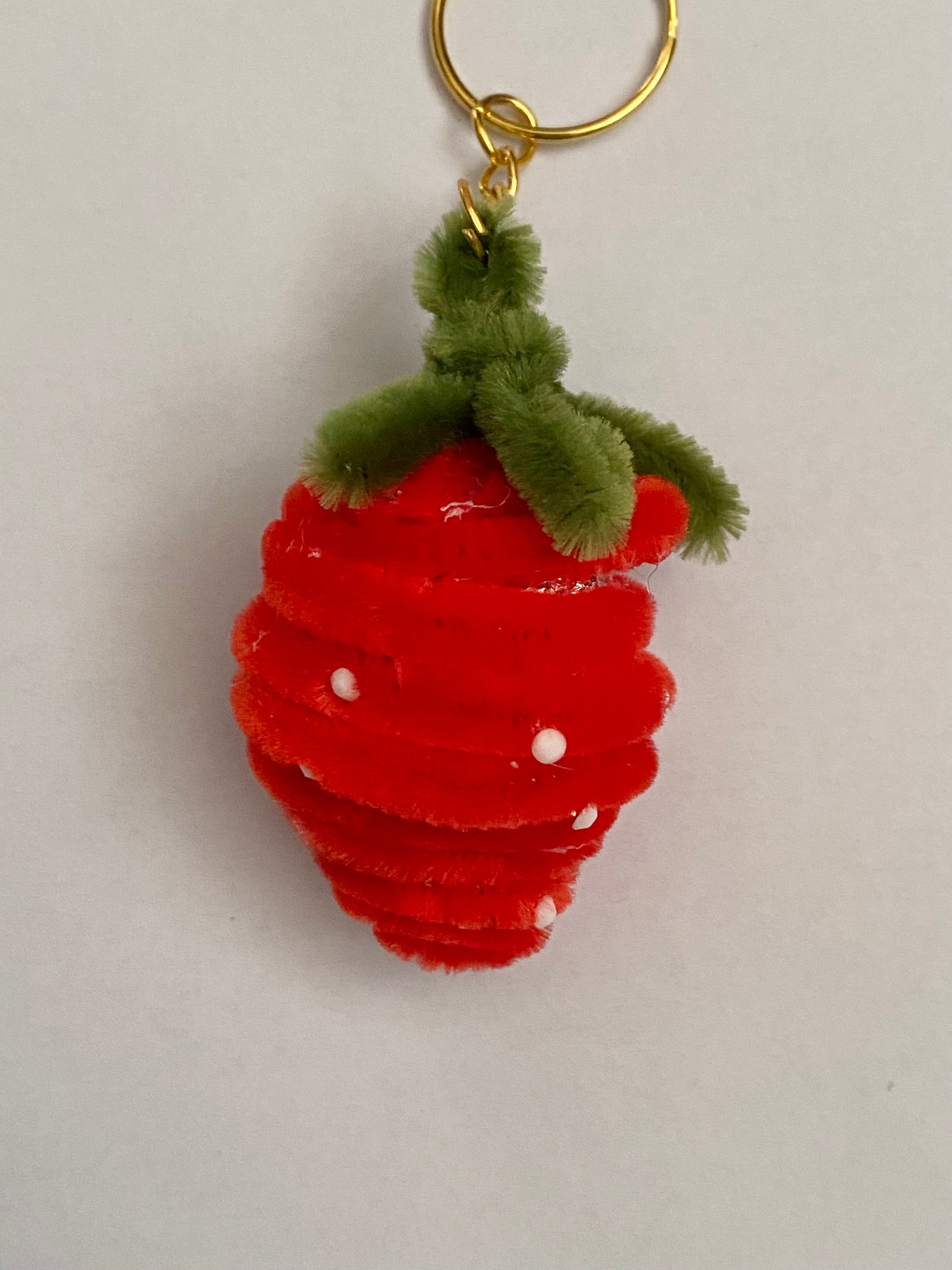 Strawberry pipe cleaner keychain.